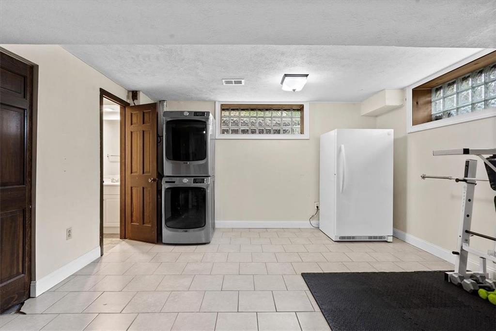 102 Bertley Ridge Drive Coraopolis, PA 15108 - Photo 21 of 24 a view of a refrigerator in kitchen and an empty room