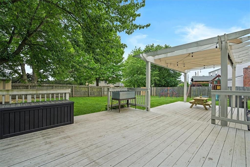 102 Bertley Ridge Drive Coraopolis, PA 15108 - Photo 22 of 24 a view of a deck with wooden floor and fence with a bench