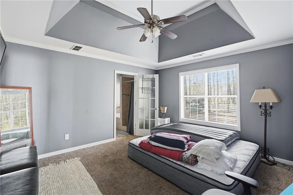 355 Radcliffe Trace Covington, GA 30016 - Photo 11 of 28 a bedroom with bed and window