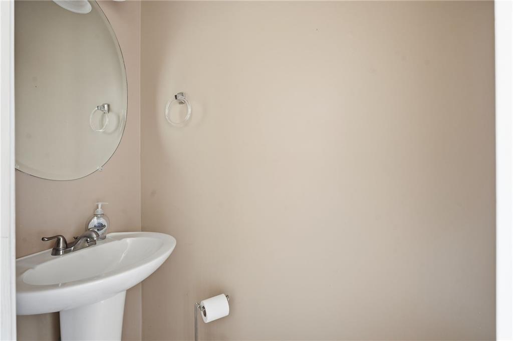 355 Radcliffe Trace Covington, GA 30016 - Photo 16 of 28 a bathroom with a sink and a mirror