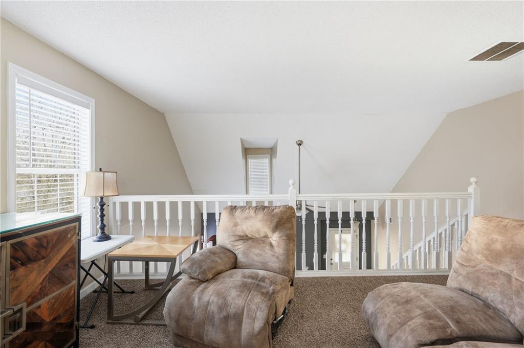 355 Radcliffe Trace Covington, GA 30016 - Photo 18 of 28 a living room with furniture and a window