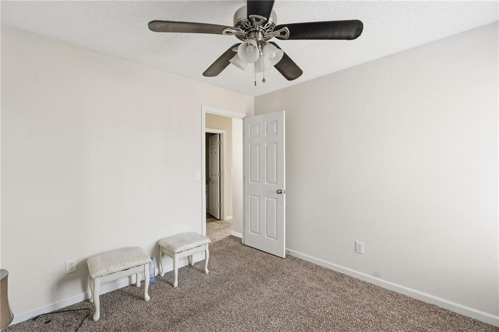 355 Radcliffe Trace Covington, GA 30016 - Photo 20 of 28 a view of room with a ceiling fan