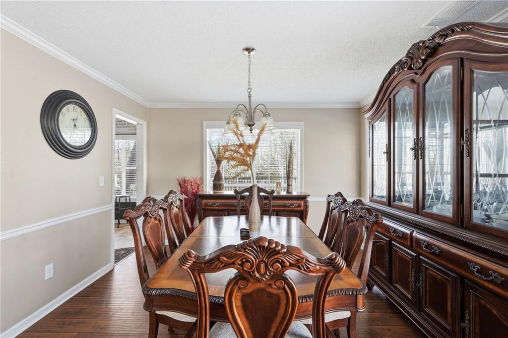 355 Radcliffe Trace Covington, GA 30016 - Photo 5 of 28 a view of a dining room with furniture and windows
