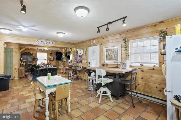 a view of a very nice looking dining room with furniture window and outside view