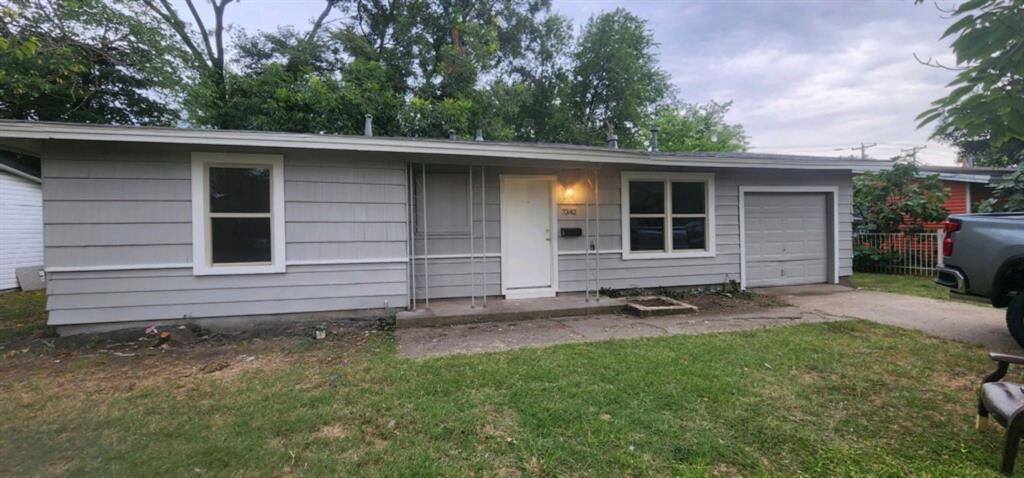 7342 Amy Street Dallas, TX 75217 - Photo 1 of 7 a backyard of a house with lots of green space