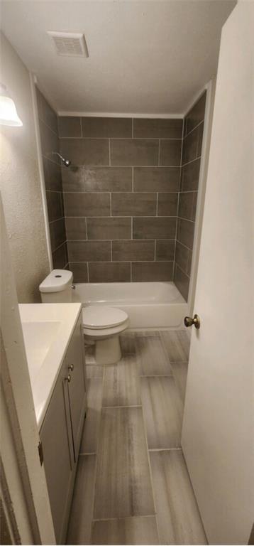 7342 Amy Street Dallas, TX 75217 - Photo 2 of 7 a bathroom with a sink a toilet and shower