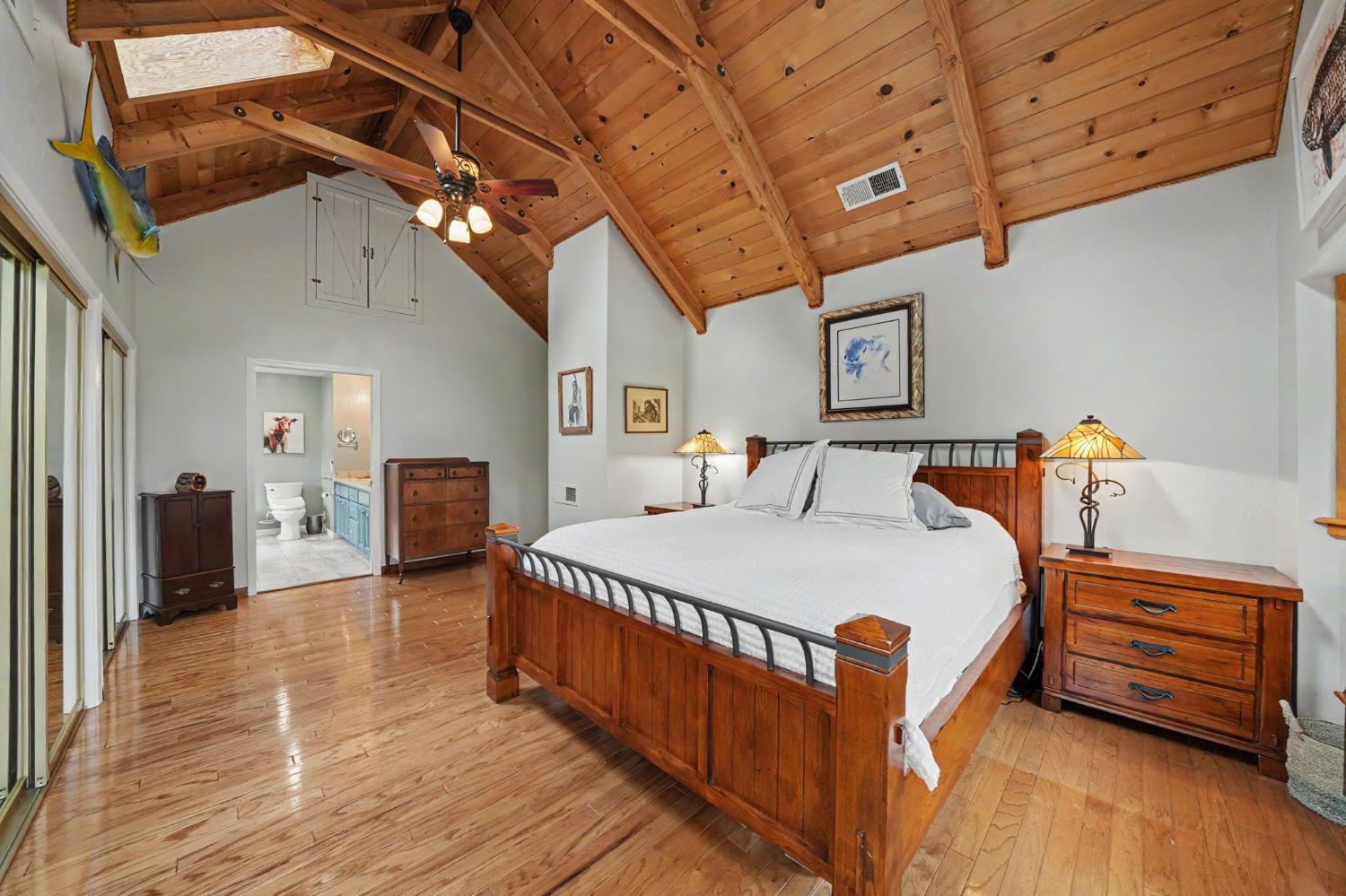 19351 Fiddletown Road Fiddletown, CA 95629 - Photo 28 of 51 a bedroom with bed and wooden floor