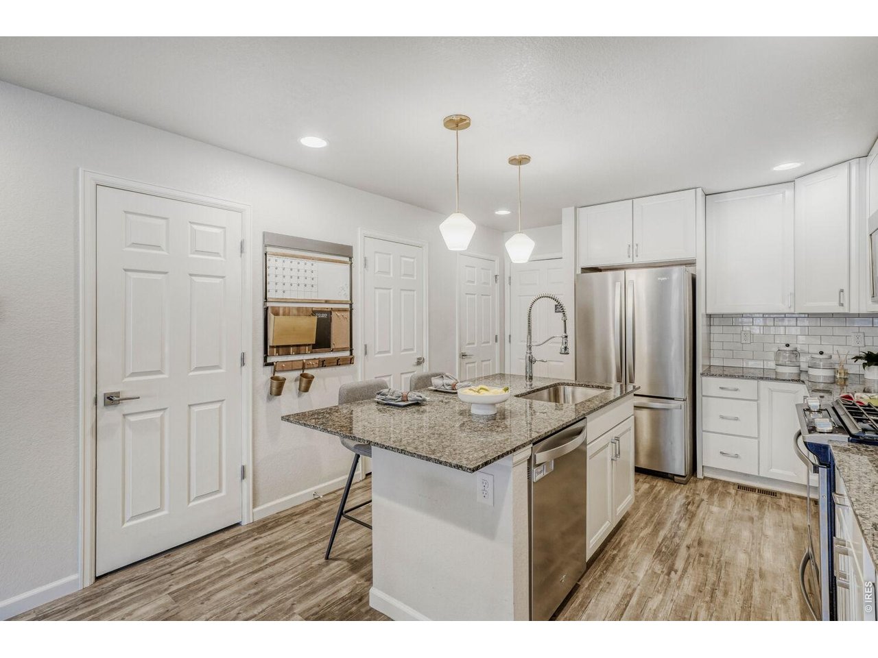 5869 Boston Street Denver, CO 80238 - Photo 10 of 34 Kitchen With Pantry and Coat Closet