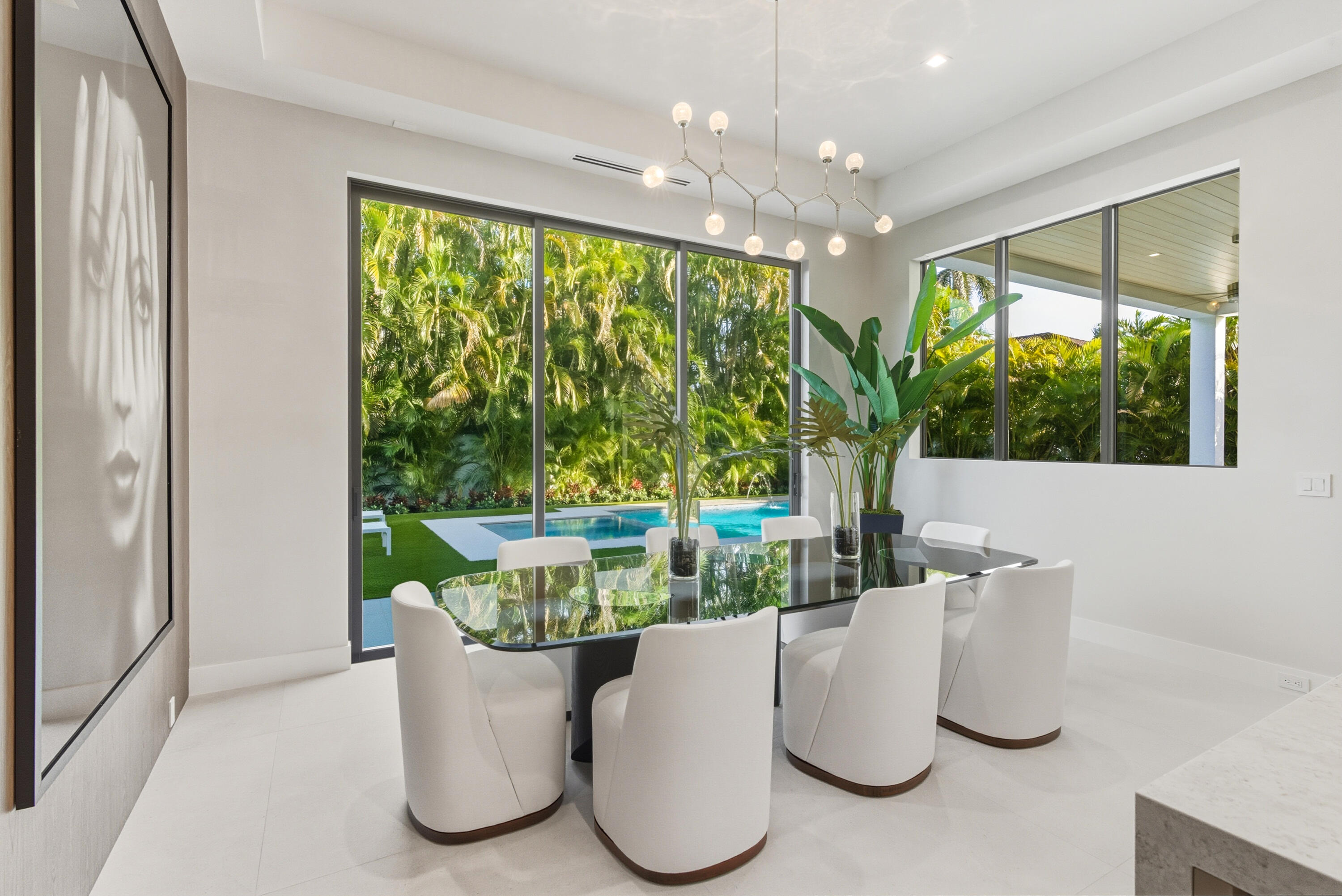 450 Northeast Spanish Court Boca Raton, FL 33432 - Photo 14 of 32 a view of table and chair in wooden floor