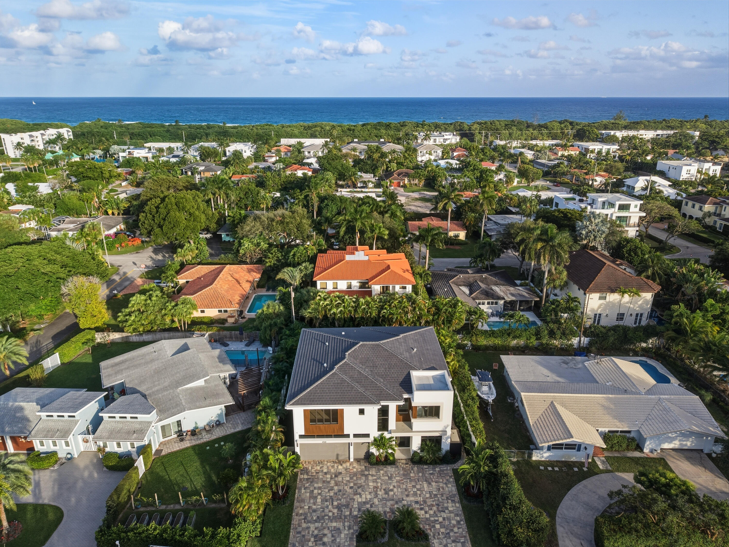 450 Northeast Spanish Court Boca Raton, FL 33432 - Photo 3 of 32 an aerial view of residential houses with outdoor space and street view
