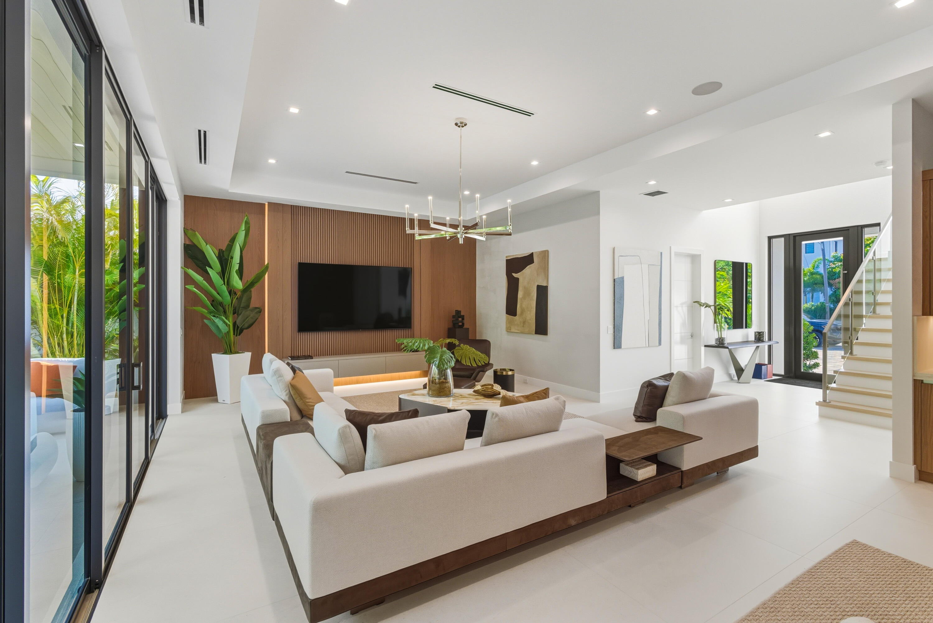 450 Northeast Spanish Court Boca Raton, FL 33432 - Photo 5 of 32 a living room with furniture and a flat screen tv