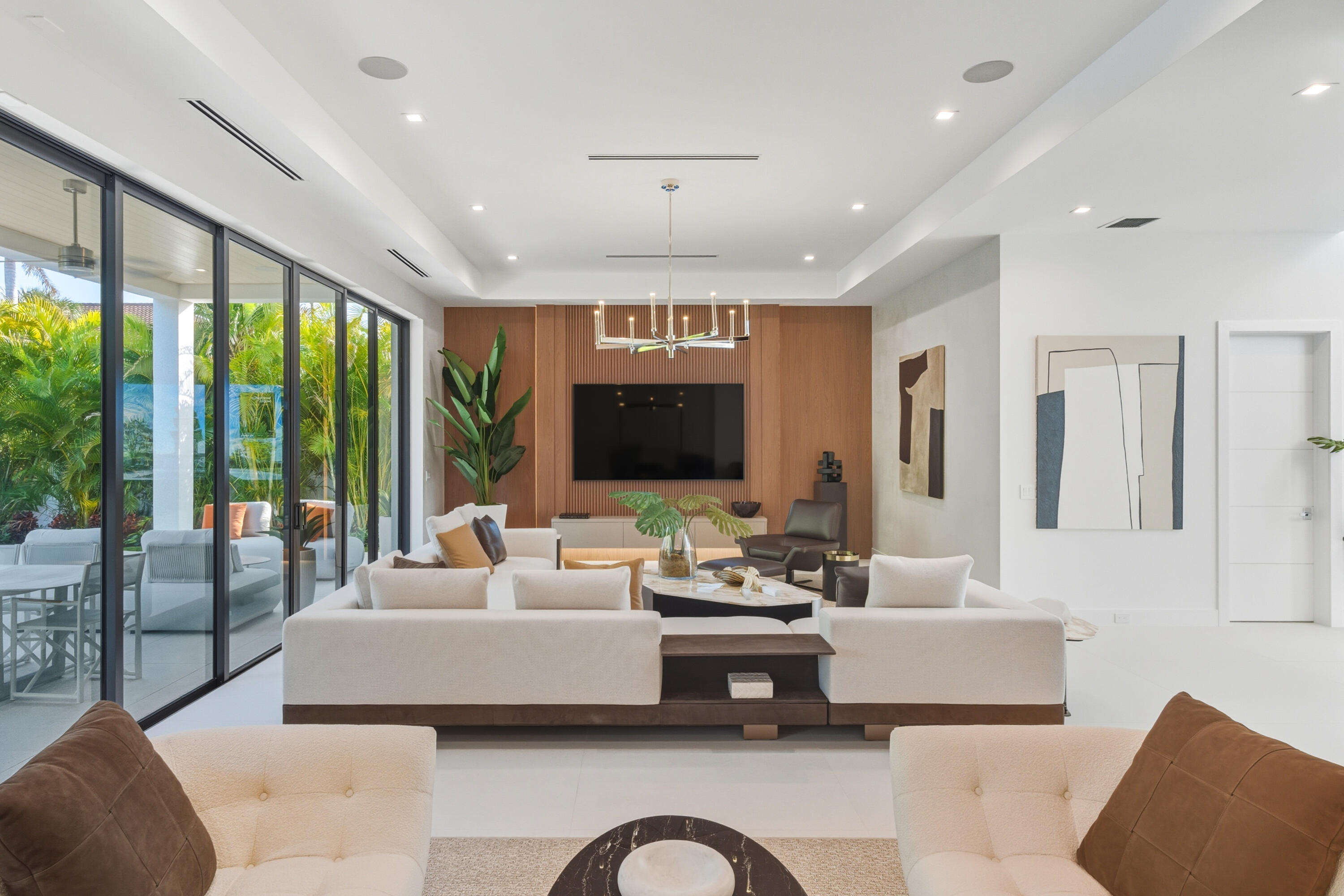 450 Northeast Spanish Court Boca Raton, FL 33432 - Photo 8 of 32 a living room with furniture ceiling fan and a large window
