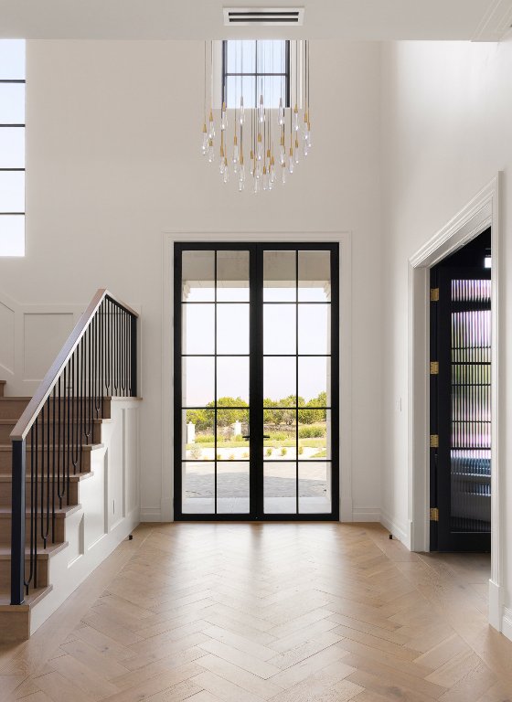 9117 Brookhurst Cove Austin, TX 78733 - Photo 4 of 40 an empty room with windows