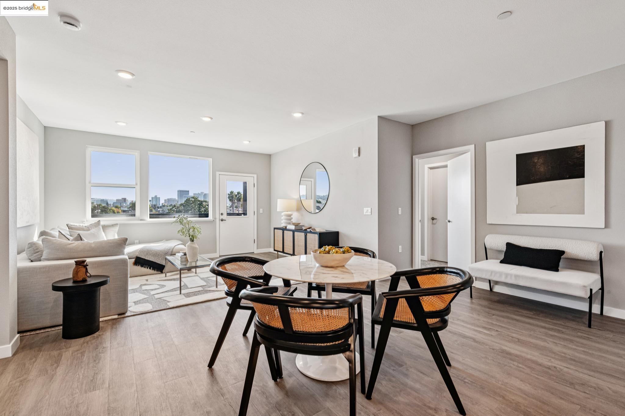 2400 Adeline Street, Unit 404 Oakland, CA 94607 - Photo 11 of 38 a living room with furniture and a wooden floor
