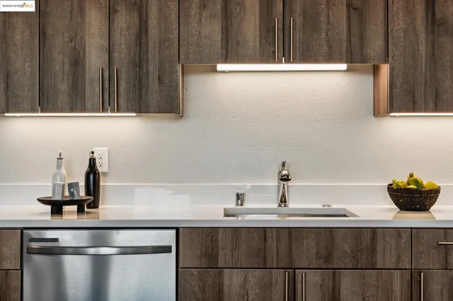 a kitchen with a sink and cabinets