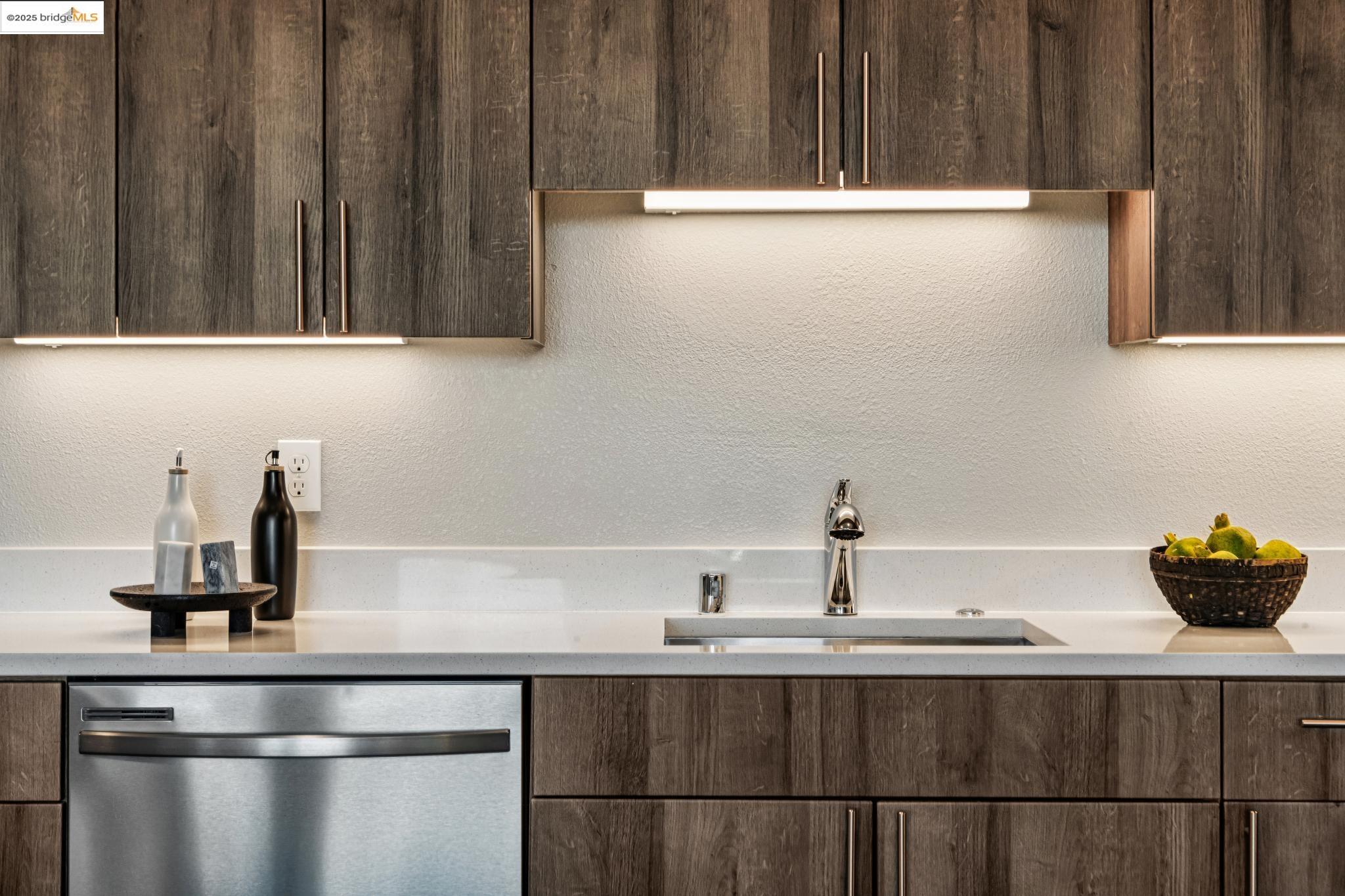 2400 Adeline Street, Unit 404 Oakland, CA 94607 - Photo 15 of 38 a kitchen with a sink and cabinets