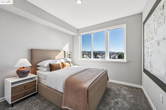 a bedroom with a bed and window