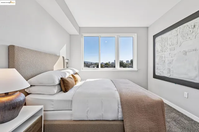 a bedroom with a bed and window