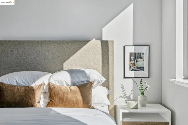 a bedroom with a bed and a couch