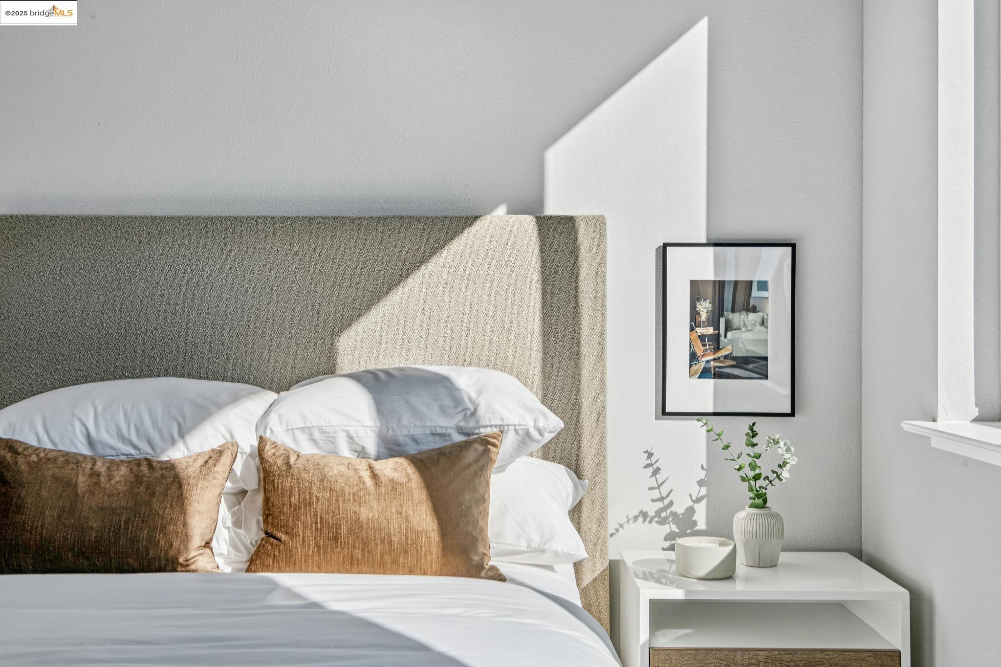 2400 Adeline Street, Unit 404 Oakland, CA 94607 - Photo 19 of 38 a bedroom with a bed and a couch