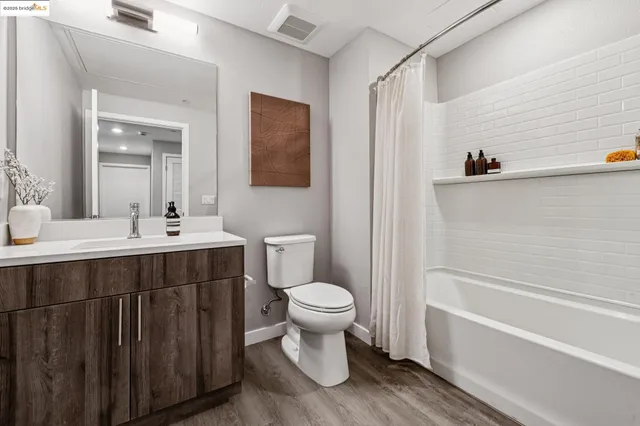 a bathroom with a sink a toilet and a bathtub