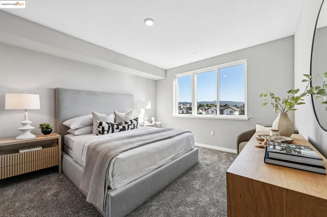a living room with furniture and a lamp