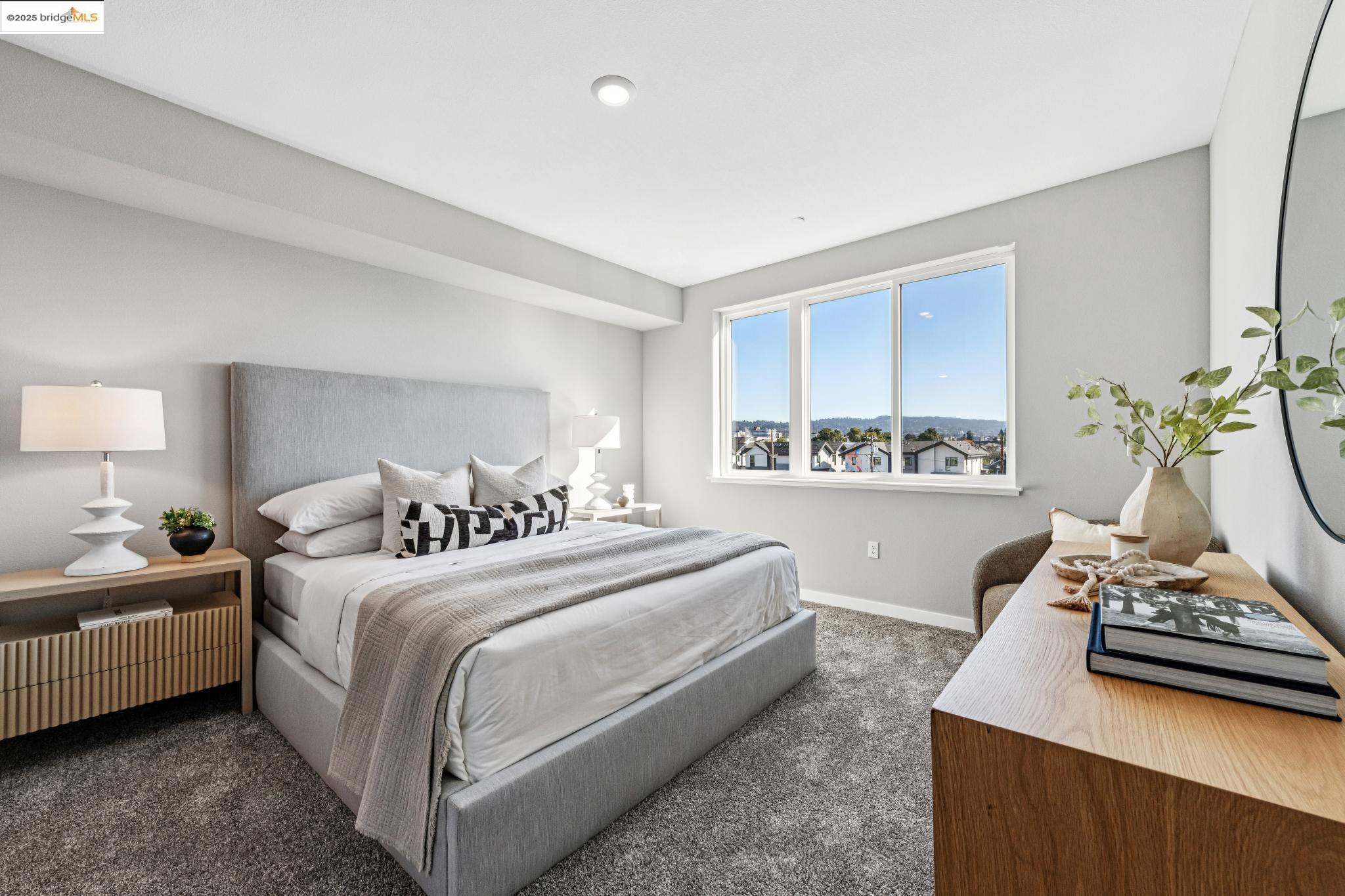 2400 Adeline Street, Unit 404 Oakland, CA 94607 - Photo 24 of 38 a bedroom with bed and window