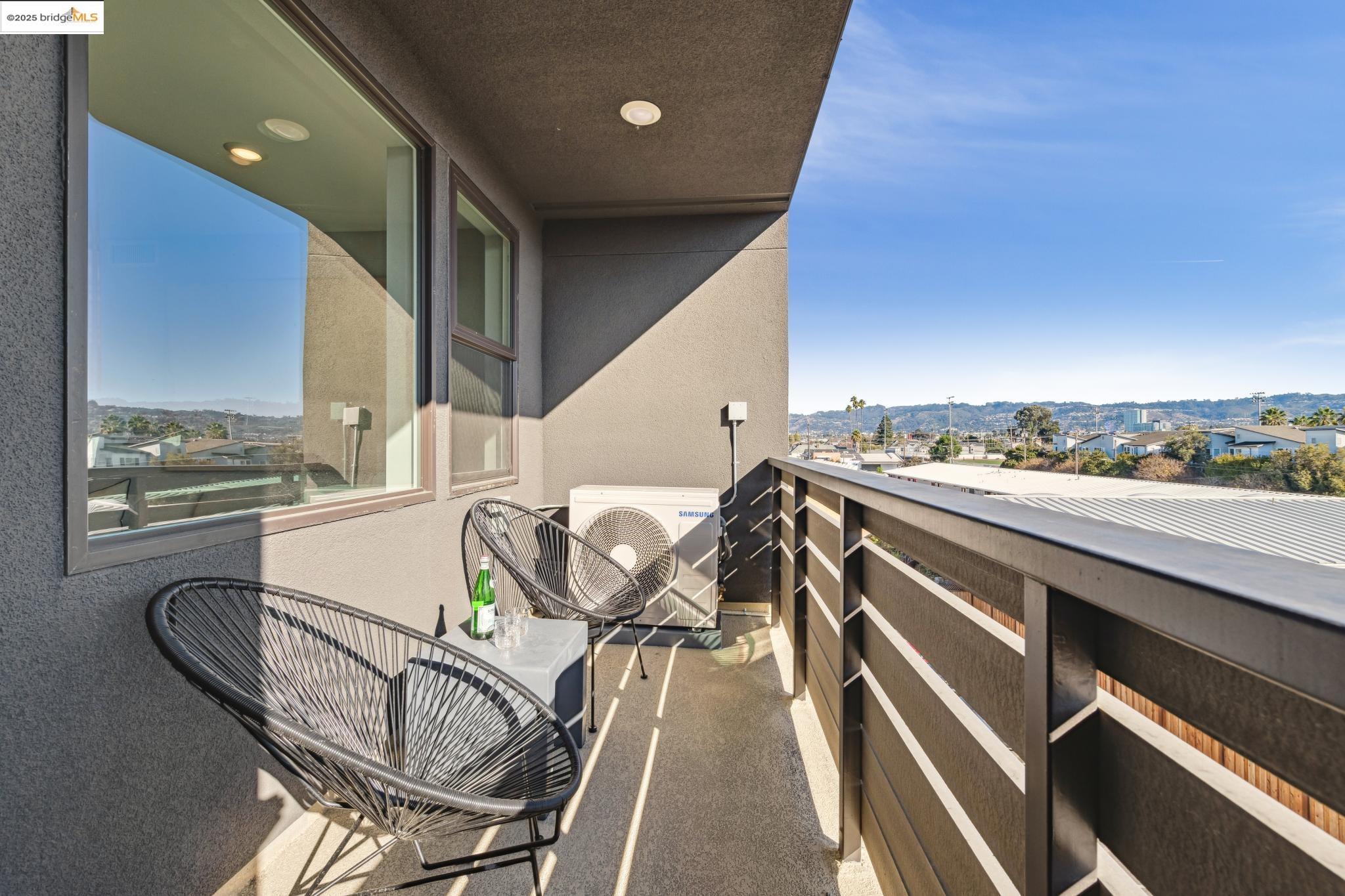 2400 Adeline Street, Unit 404 Oakland, CA 94607 - Photo 34 of 38 a view of a chairs and table in the balcony