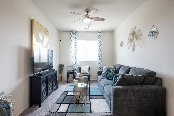 a living room with furniture fireplace and flat screen tv