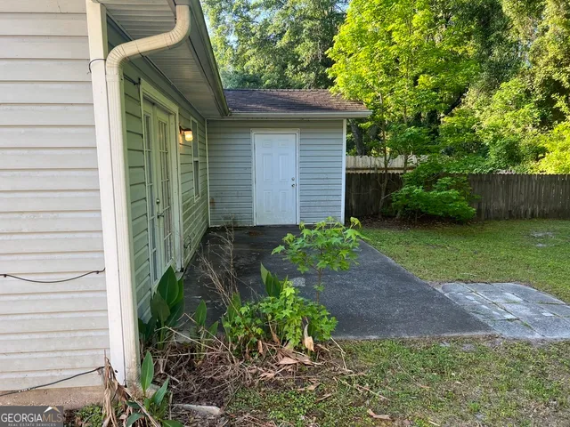a view of a backyard with plants