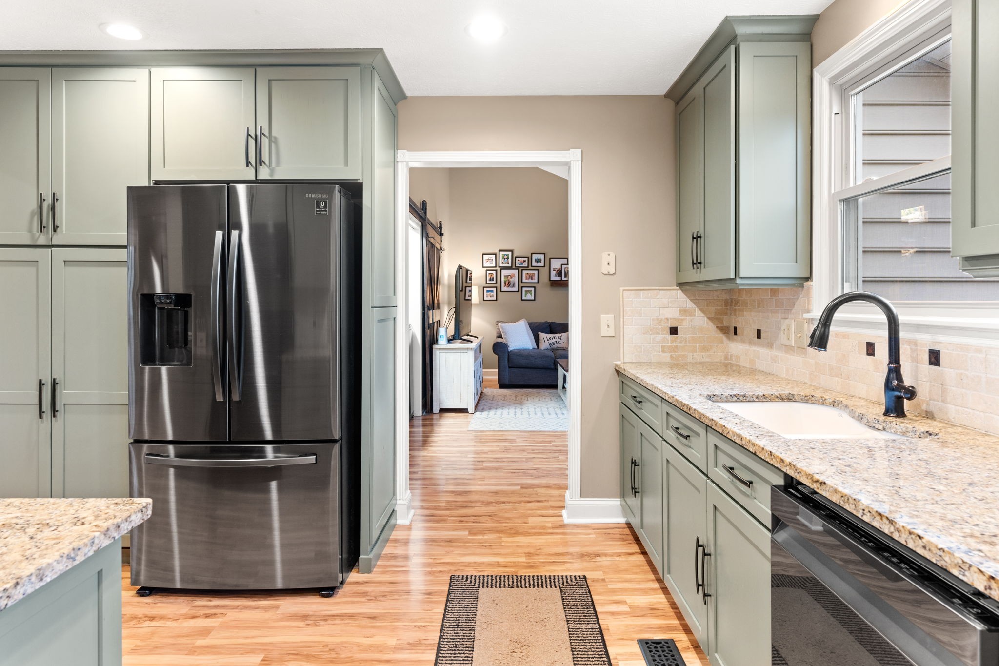 121 Ridgemar Trail Hendersonville, TN 37075 - Photo 12 of 46 a kitchen with kitchen island granite countertop a refrigerator and a sink