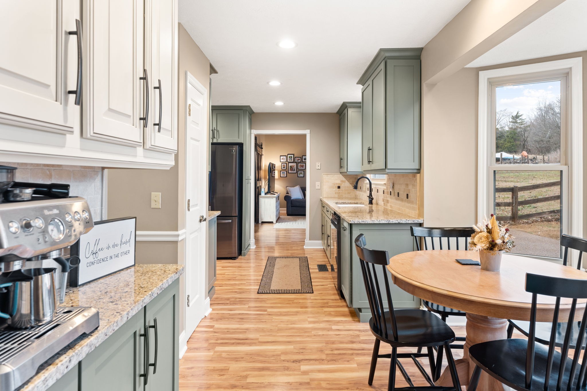 121 Ridgemar Trail Hendersonville, TN 37075 - Photo 13 of 46 a dining hall with stainless steel appliances granite countertop a dining table chairs and a refrigerator a oven with wooden floor