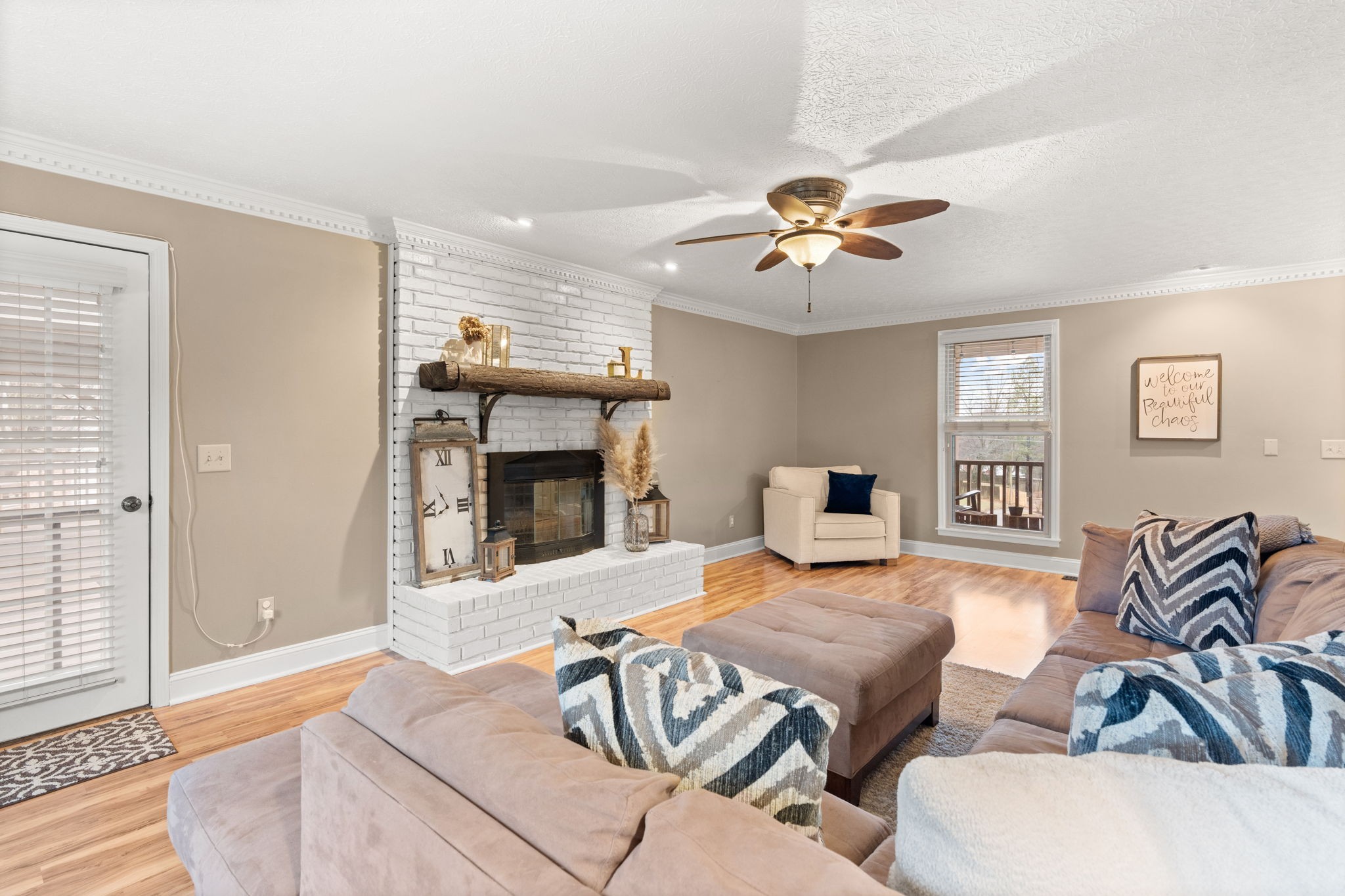 121 Ridgemar Trail Hendersonville, TN 37075 - Photo 17 of 46 a living room with furniture a fireplace and a flat screen tv