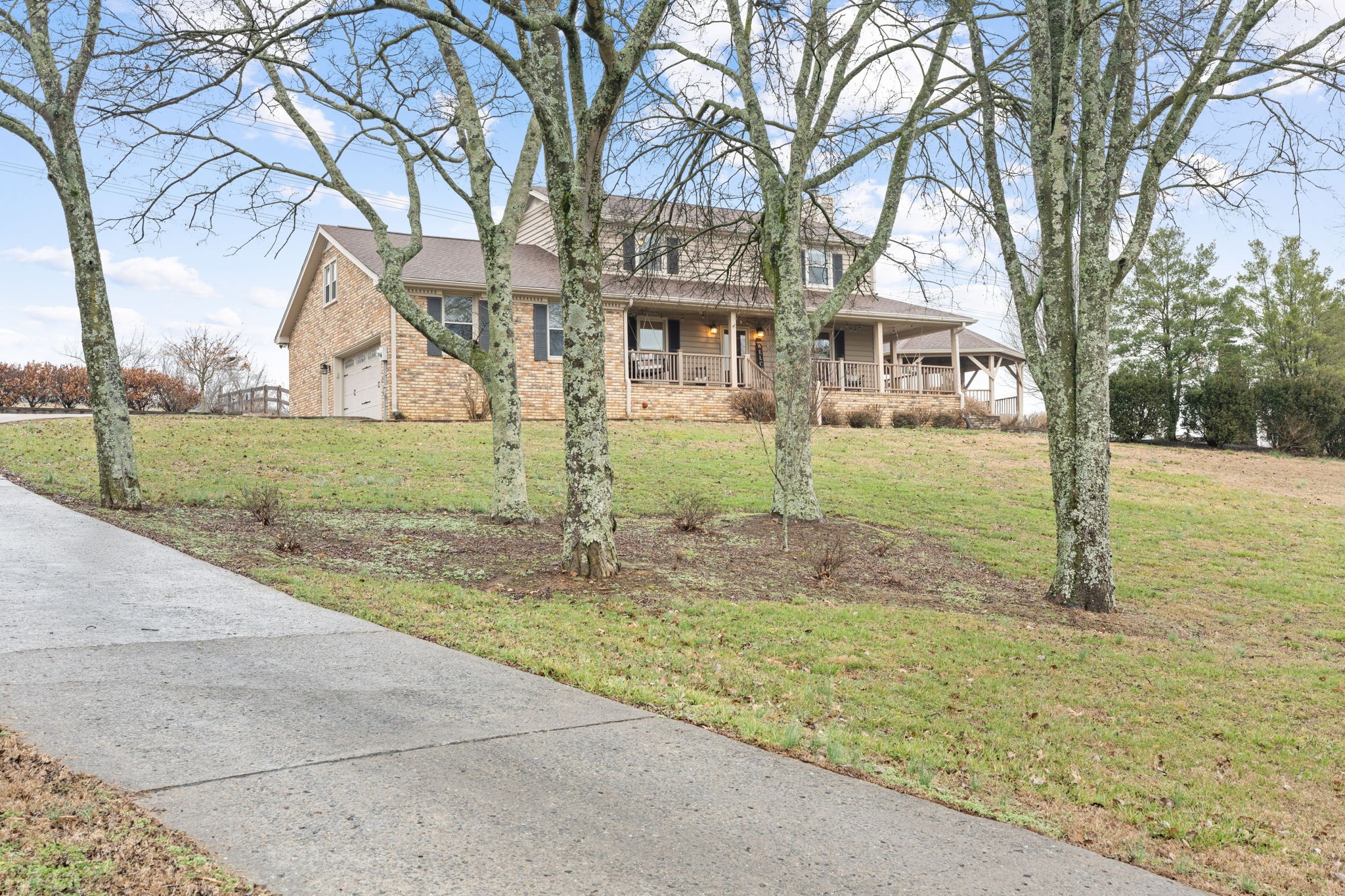121 Ridgemar Trail Hendersonville, TN 37075 - Photo 3 of 46 a front view of a house with garden