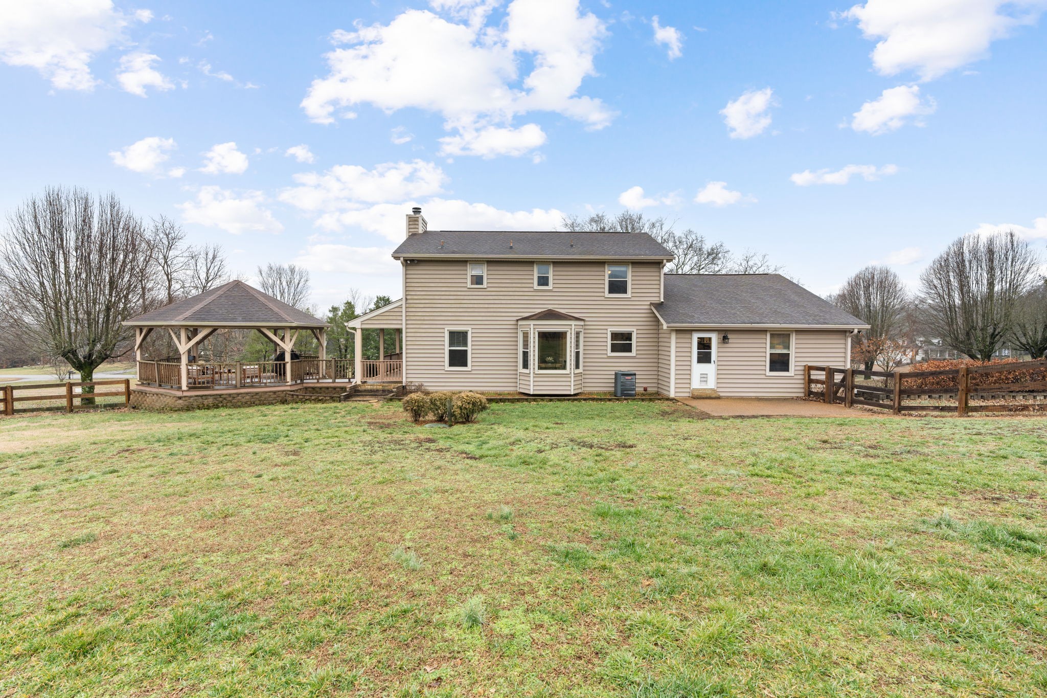 121 Ridgemar Trail Hendersonville, TN 37075 - Photo 34 of 46 a view of a white house with a big yard and large trees