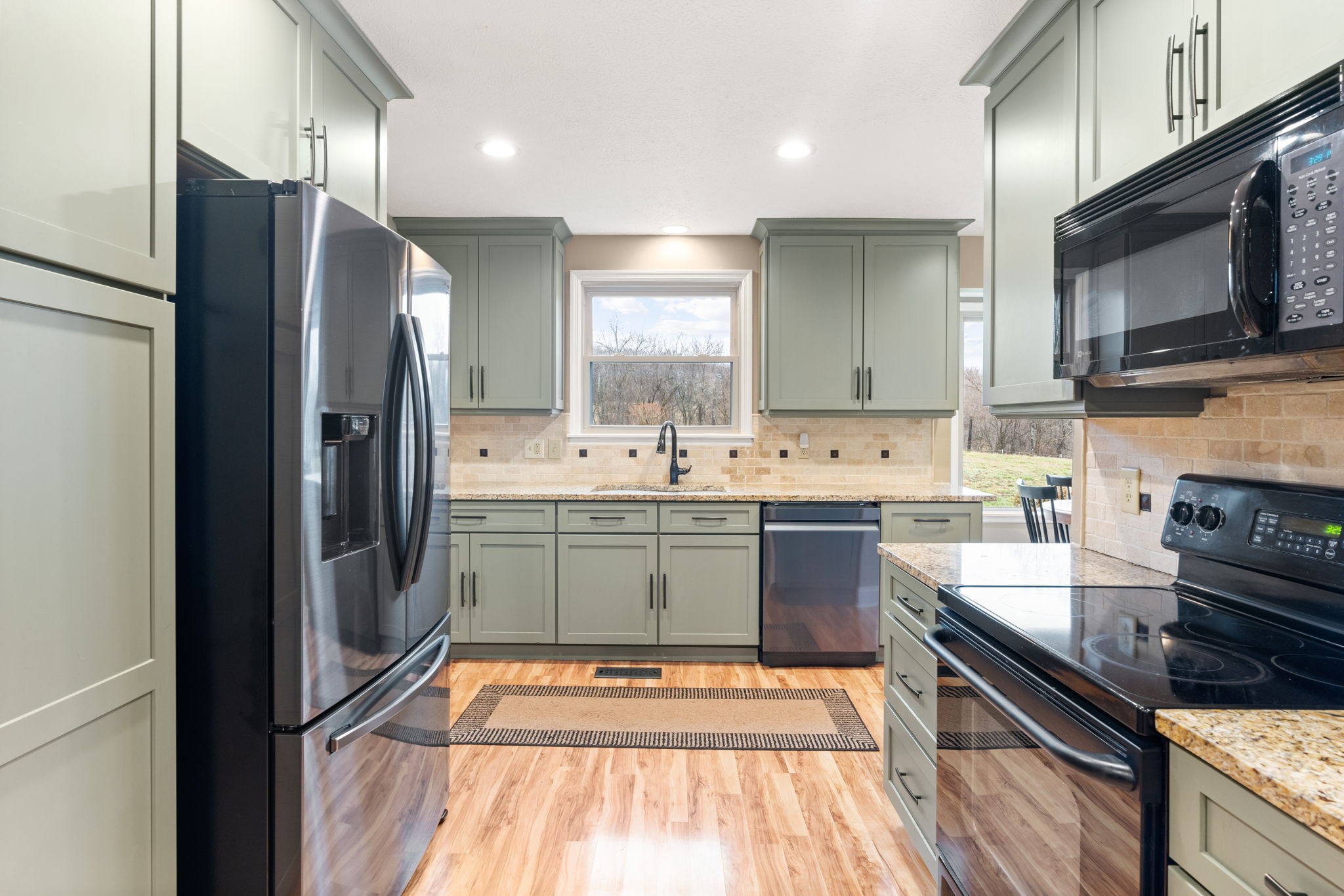 121 Ridgemar Trail Hendersonville, TN 37075 - Photo 10 of 46 a kitchen with stainless steel appliances a sink stove and refrigerator