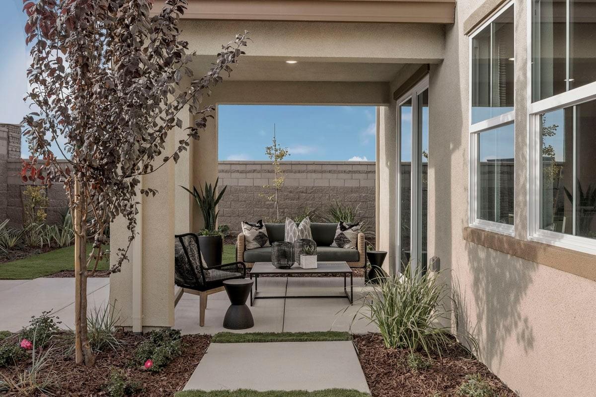1701 Apiary Way Hughson, CA 95326 - Photo 10 of 13 a living room with patio furniture and flowers