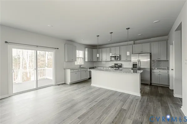 a kitchen with granite countertop a sink and a window