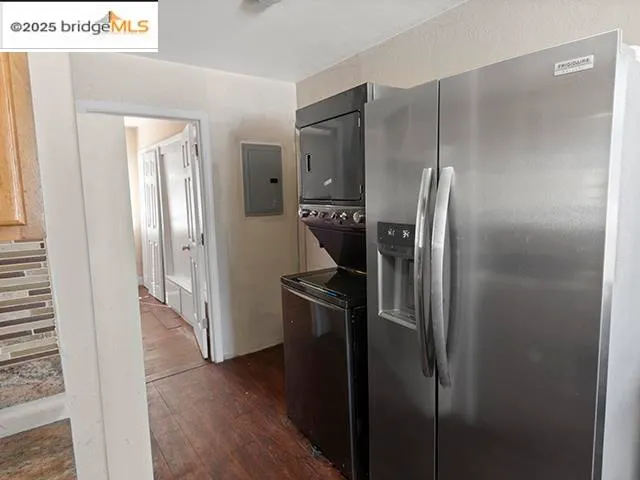 a kitchen with stainless steel appliances a refrigerator and a sink