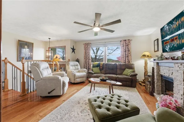 a living room with furniture and a fireplace