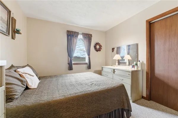 a bedroom with a bed and a cabinets