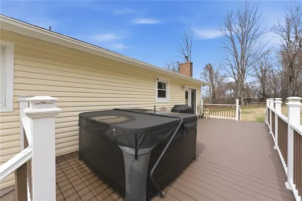 a view of a house with a wooden deck