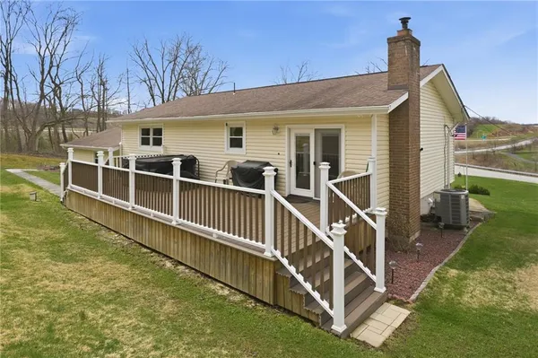 a view of a swimming pool with a terrace