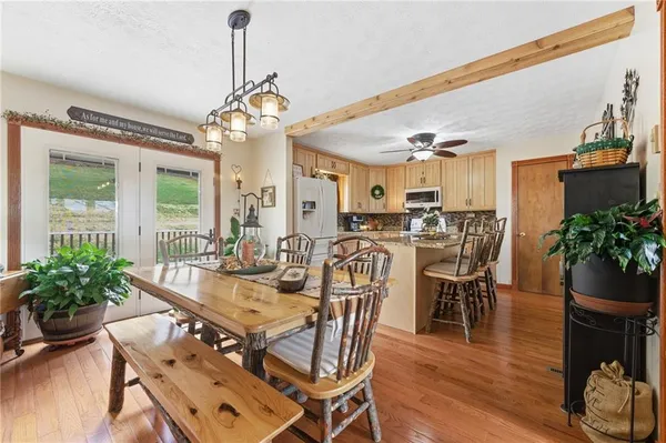 a view of a dining room with furniture window and wooden floor