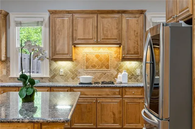 a kitchen with counter space and stainless steel appliances
