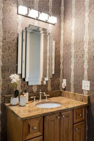 a spacious bedroom with a bed and a fireplace