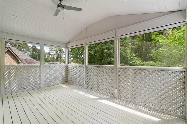 a spacious bedroom with a large bed and a window
