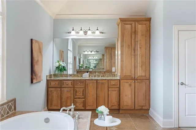 a utility room with sink dryer and washer