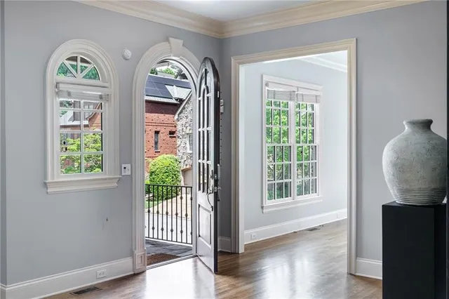 a view of front door with wooden floor
