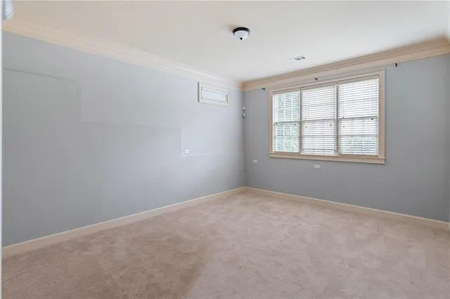 a bathroom with a granite countertop sink toilet mirror and shower